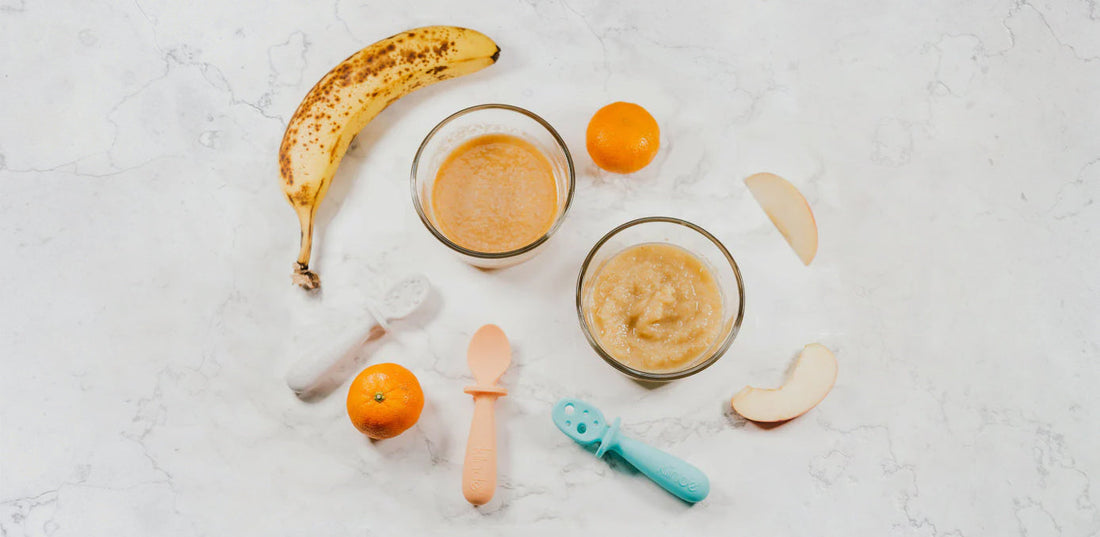 Image of solid baby food in bowls, Kiinde Lil Bites Spoons, tangerines, apple slices, and a banana