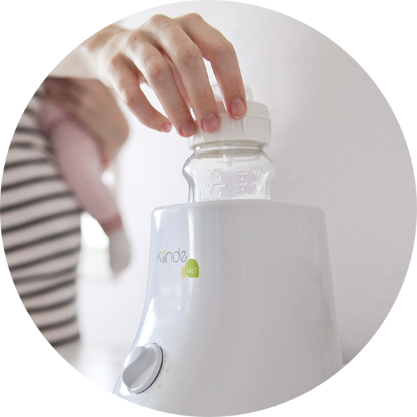 A bottle in the Kiinde Kozii Bottle Warmer.